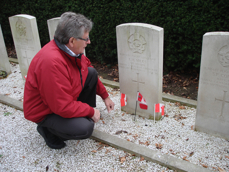 Harold Milks visitng the grave of his brother Erle at Heteren Cemetery